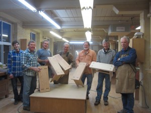 1st Avenue Woodworking registrants show off their completed projects created in Ed Schoen's furniture making class.